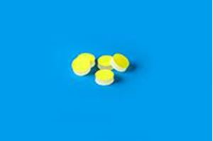 Picture of 9.5mm (3/8") Diameter Low Bleed Yellow PTFE/Cream Silicone Septa, 3mm Thick, Max Temp 250°C