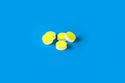 Picture of 11mm (7/16") Diameter Low Bleed Yellow PTFE/Cream Silicone Septa, 3mm Thick, Max Temp 250°C